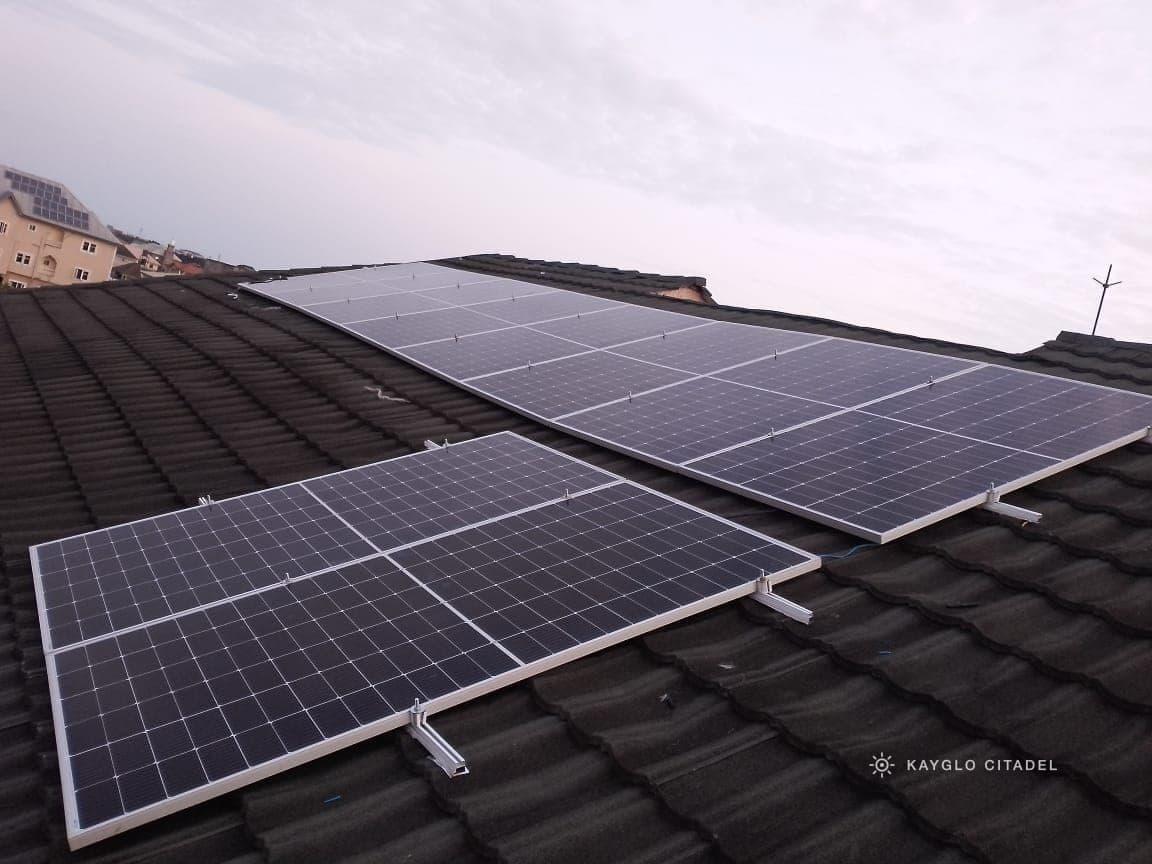 A Kayglo solar array installed across a tiled roof at dusk.